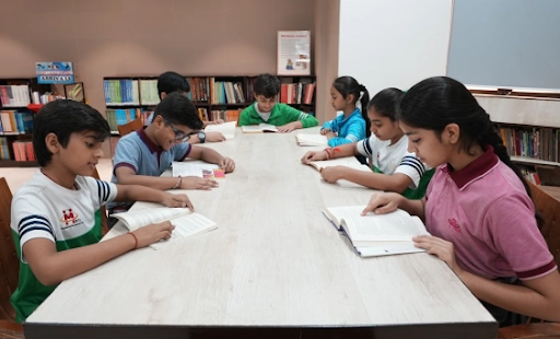 Students reading together in a school library