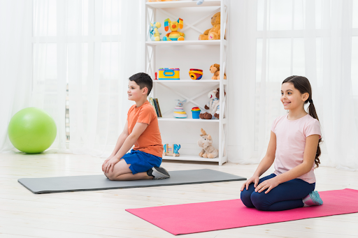 Children practicing yoga indoors