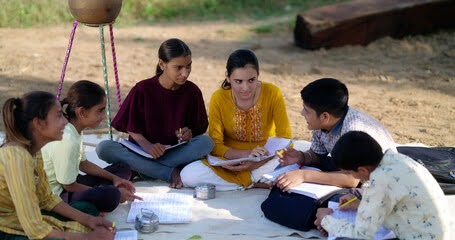 Students engaged in collaborative outdoor learning and group discussion