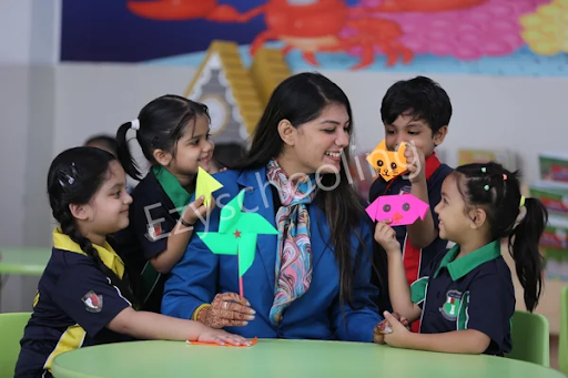 Happy preschool students learning through creative play at school