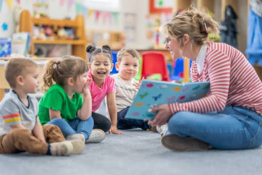 Teacher reading to kids during early years classroom routine
