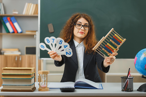 Teacher with number cards and abacus