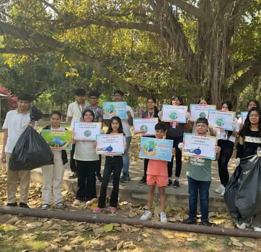 Students with eco-awareness posters during cultural immersion