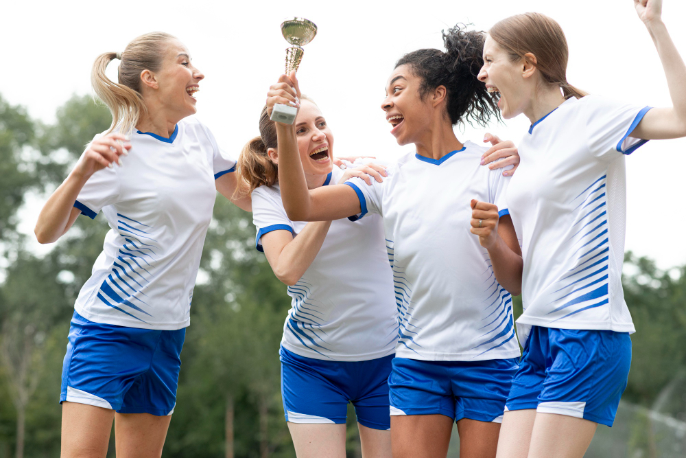 women's football team celebrating their win