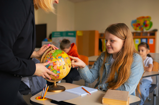 Student learning with a globe