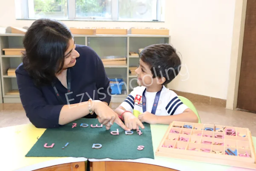 Teacher helping child learn letters through play