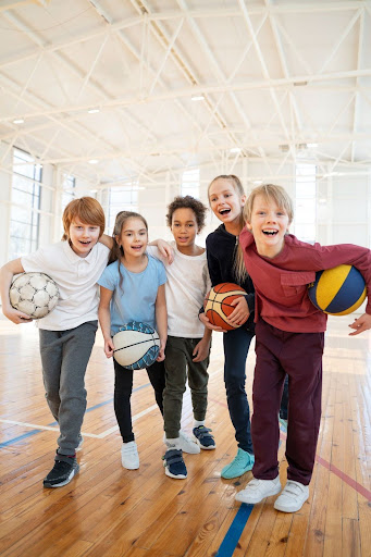 Children playing sports indoors