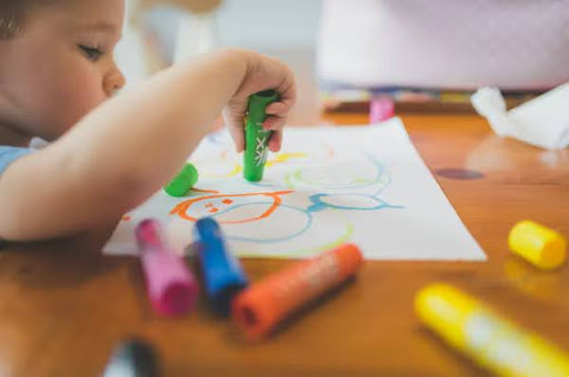 Child engaged in creative art activity