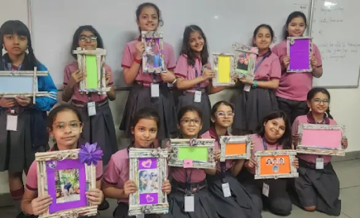Students showcasing handmade craft projects and creative learning