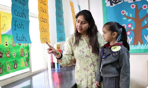 Teacher guiding a student in class