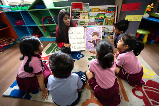 Teacher reading a story to preschool children