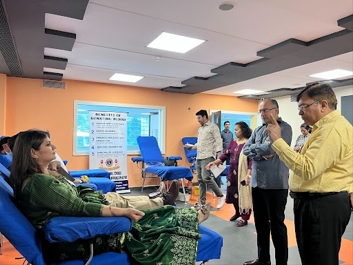 People participating in a blood donation and health awareness drive