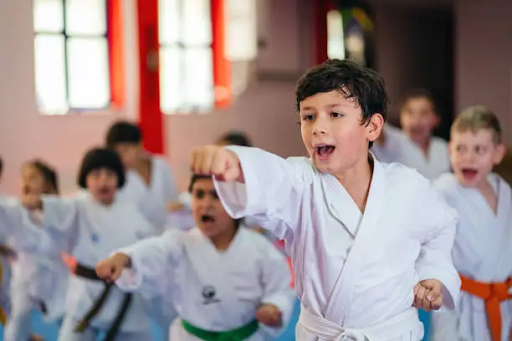 Young students learning karate techniques in a structured training session