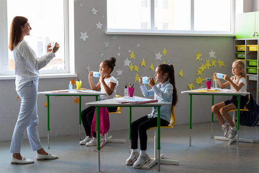 Teacher guiding students in a classroom activity