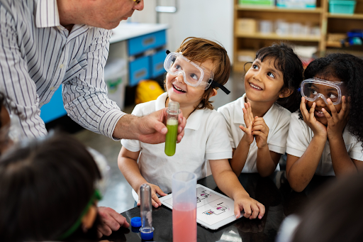 Students conducting a hands-on science experiment with a teacher