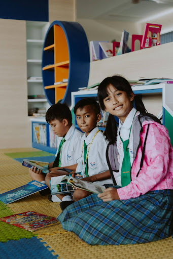 Students reading and learning together in a school library